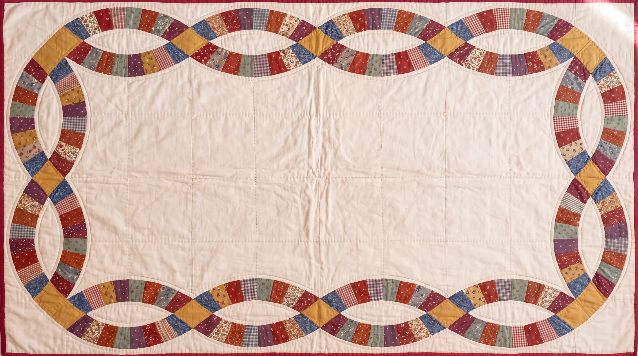 A Double Wedding Ring quilt laid flat